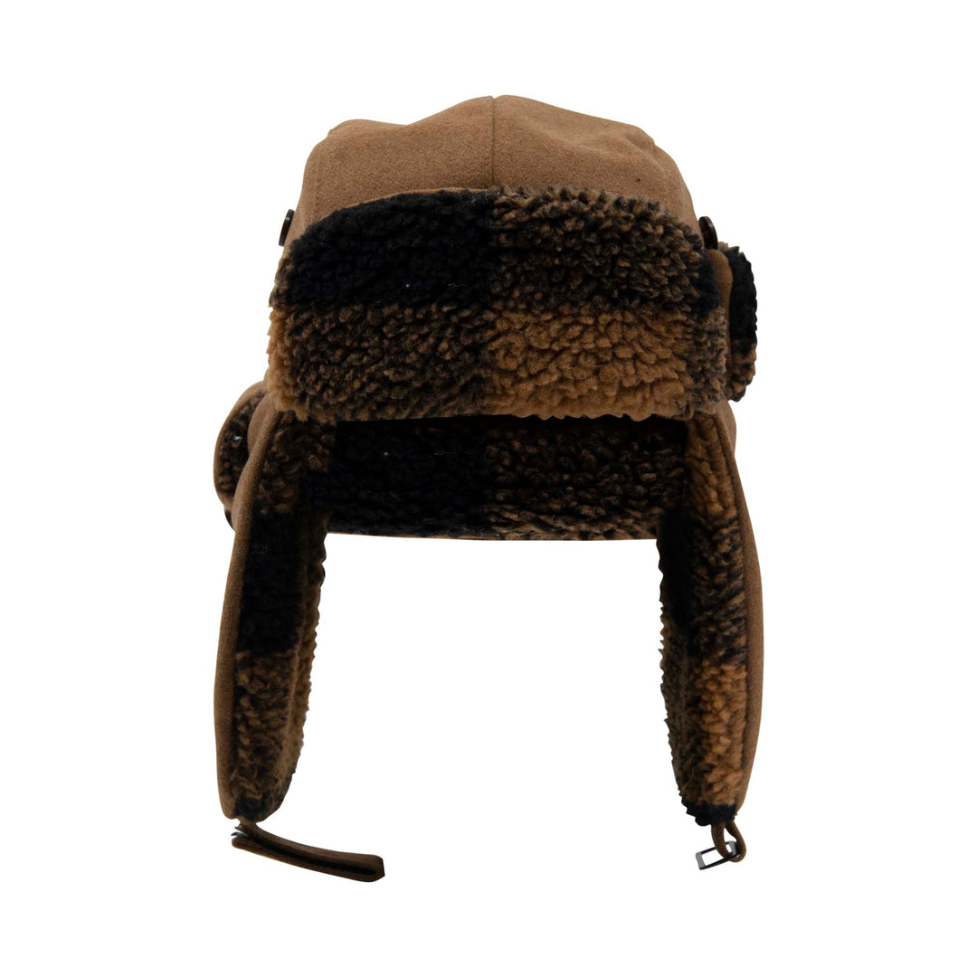 A brown and black trapper hat with a tan wool cap, black and brown sherpa ear flaps, and a black chin strap, shown against a plain white background.