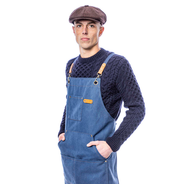 Canvas utility apron in navy waxed cotton – front view