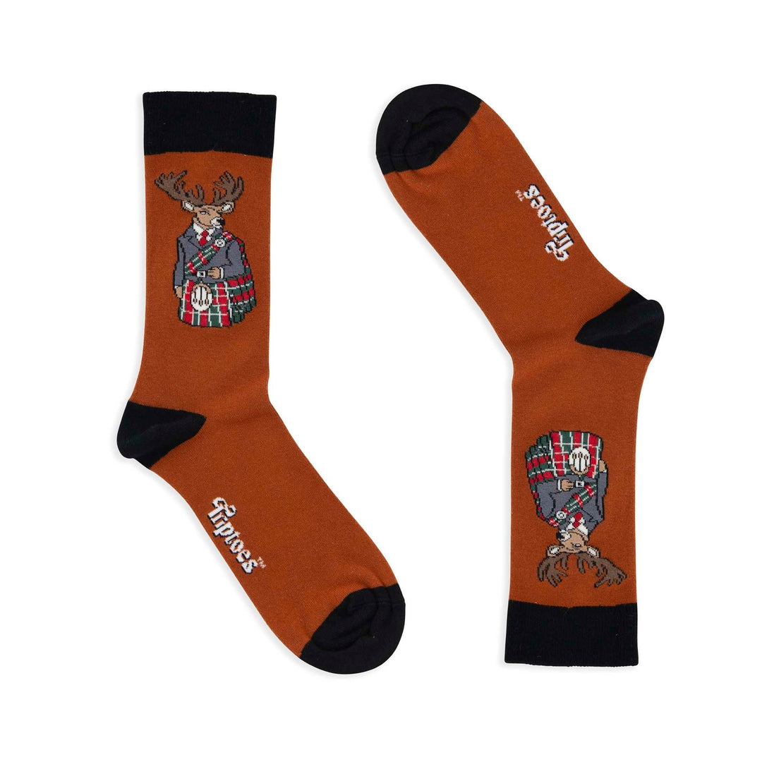 Pair of socks with a design of a deer wearing a kilt on a white background