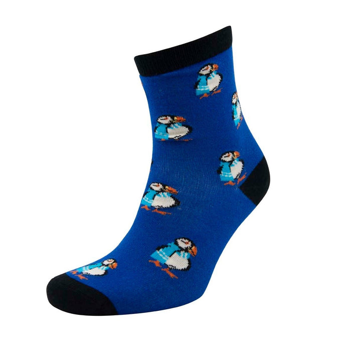 Blue sock with puffin pattern on a white background